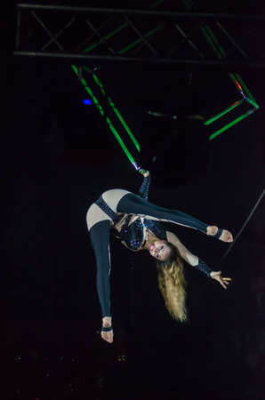 DNIPRO, UKRAINE - DECEMBER 13, 2019:  Rumyantsev Anna  performs Aerial gymnastics in Cube at the Circus.のeditorial素材