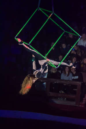 DNIPRO, UKRAINE - DECEMBER 13, 2019:  Rumyantsev Anna  performs Aerial gymnastics in Cube at the Circus.のeditorial素材