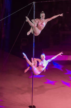 DNIPRO, UKRAINE - DECEMBER 13, 2019:  Gymnasts on the pylon Anastasia and Catherine Gavrilov perform at the Circus.のeditorial素材