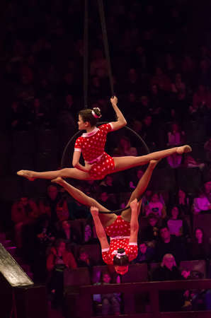 DNIPRO, UKRAINE - DECEMBER 14, 2019: Unidentified girls, age 11 years old, perform Air gymnastics at the Circus.のeditorial素材