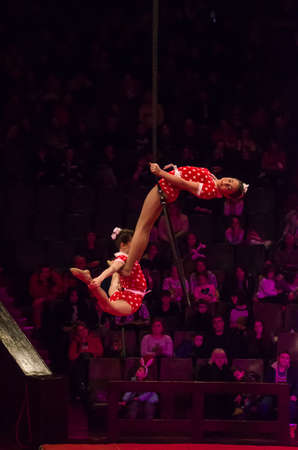 DNIPRO, UKRAINE - DECEMBER 14, 2019: Unidentified girls, age 11 years old, perform Air gymnastics at the Circus.のeditorial素材