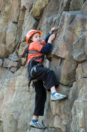 DNEPROPETROVSK, UKRAINE - APRIL 2: Ukrainian girl in action during urban mountaineering competitions among children on April 2, 2011 in Dnepropetrovsk, Ukraineのeditorial素材