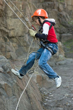 DNEPROPETROVSK, UKRAINE - APRIL 2: Ukrainian boy in action during urban mountaineering competitions among children on April 2, 2011 in Dnepropetrovsk, Ukraineのeditorial素材