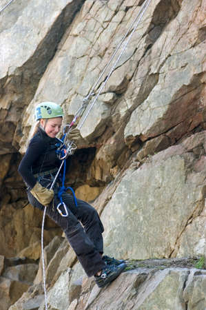 DNEPROPETROVSK, UKRAINE - APRIL 2: Ukrainian girl in action during urban mountaineering competitions among children on April 2, 2011 in Dnepropetrovsk, Ukraineのeditorial素材