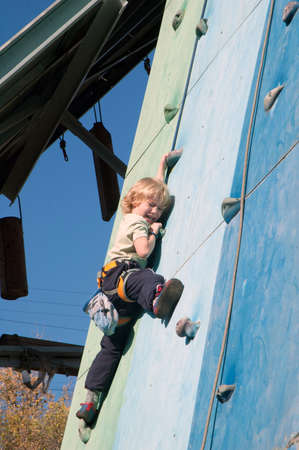 DNEPROPETROVSK, UKRAINE - OCTOBER 20: An unidentified seven-year-old boy in action during urban climbing competitions among children on October 20, 2012 in Dnepropetrovsk, Ukraineのeditorial素材