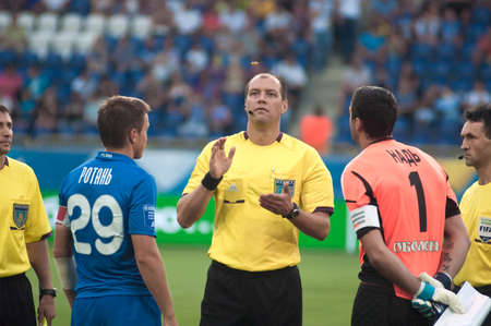 DNEPROPETROVSK, UKRAINE - AUGUST 11: Dmitry Kutakov referee (C) at the Uk. Championship football game FC Dnepr vs. FC Hoverla on August 11 , 2012 in Dnepropetrovsk, Ukraineのeditorial素材