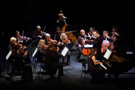 DNEPROPETROVSK, UKRAINE  OCTOBER 22: Four seasons Chamber Orchestra - main conductor Dmitry Logvin perform music of Johann Sebastian Bach on October 22, 2012 in Dnepropetrovsk, Ukraineのeditorial素材