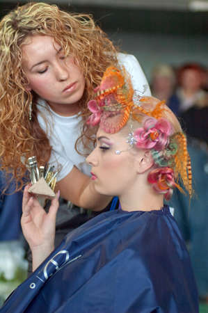 DNEPROPETROVSK, UKRAINE - MARCH 28: Stylist and his model prepar for the Championship on hairdressing, nail aesthetics and make YOUNG TALENTS OF UKRAINE on Mach 28, 2008 in Dnepropetrovsk, Ukraineのeditorial素材