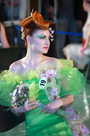 DNEPROPETROVSK, UKRAINE - MARCH 23: Model prepares backstage during the Championship on hairdressing, nail aesthetics and make YOUNG TALENTS OF UKRAINE on Mach 23, 2007 in Dnepropetrovsk, Ukraineのeditorial素材