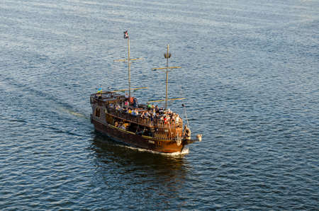 DNIPRO, UKRAINE - JULE 21, 2020: The Black Pearl ship is making a river trip in the Dnieper water...