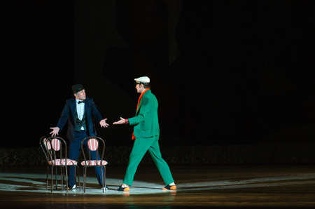 DNIPROPETROVSK, UKRAINE - OCTOBER 9: Members of the Dnepropetrovsk State Opera and Ballet Theater perform FOXTROT 12 CHAIRS on October 9, 2014 in Dnepropetrovsk, Ukraine.のeditorial素材