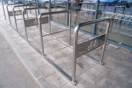 Bicycle parking near the grocery store for personal transport.の写真素材