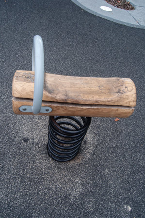 A swinging toy wooden platform for children on a playground.の写真素材