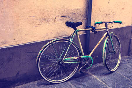 old retro green bicycle on the parkingの写真素材