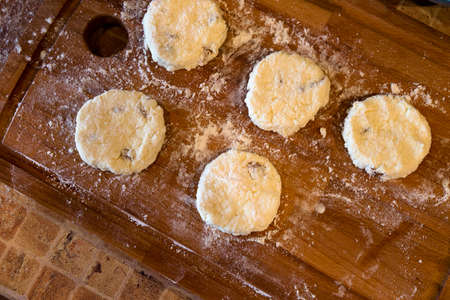 cooking cottage cheese pancakes on the wood boardの写真素材
