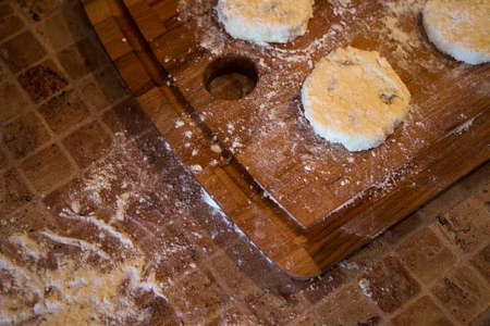cooking cottage cheese pancakes on the wood boardの写真素材