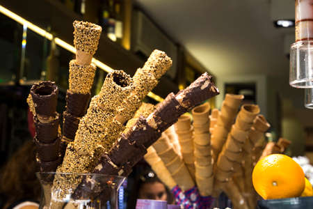 different ice cream cones in the gelateria cafe in italy (nut, chocolate, ordinary)