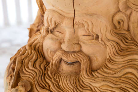 carved face of an old man made from a tree, Tomsk, Russia 2018-04-01のeditorial素材