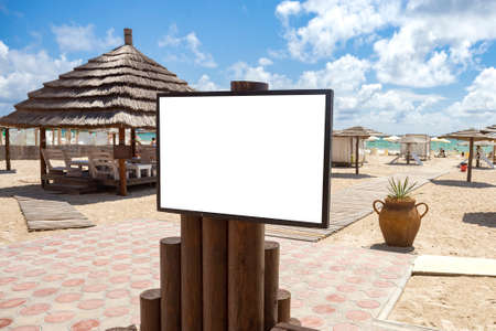 blank mockup outdoor advertising with copy space on beach near the seaの写真素材