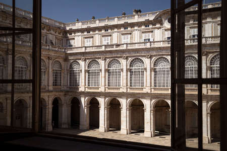 View thru window on the arches and windows in the yard of majestic, beautiful Royal Palace of Madrid...