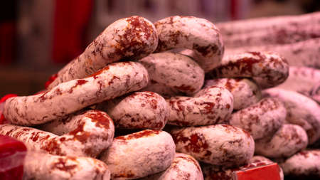 Traditional premium spicy chorizo on the market showcase. Tasty gourmet delicatessen.の写真素材