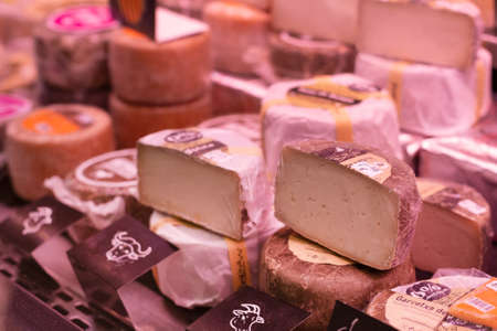 Traditional premium spanish cheese on the market showcase. Delicious gourmet product. Spain, Catalonia, Barcelona 2019-04-30のeditorial素材