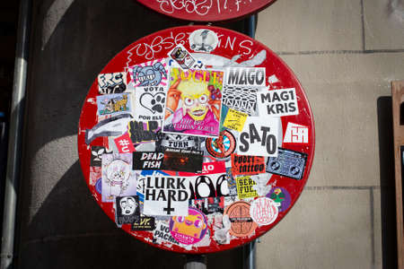 road sign covered by stickers on the street of Barcelona, Catalonia, Spain. 30 April, 2019のeditorial素材