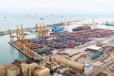 Aerial view on the sea port and containers with modern tilt-shift photo effect. Barcelona, Catalonia, Spain 2019-04-28のeditorial素材