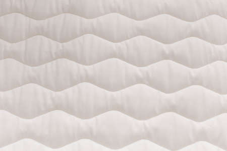 Close up mattress texture. Comfortable sleep concept. New modern mattress, for background. .
