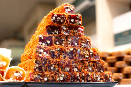 Traditional delicious turkish desserts in the shop window showcase. Different kinds of turkish delights. Popular souvenirs and snacks from Turkey.の写真素材