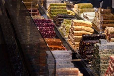 Traditional delicious turkish desserts in the shop window showcase. Different kinds of turkish delights. Popular souvenirs and snacks from Turkey.の写真素材