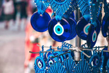 Evil eye bead protection amulet in the shop or market. One of the most popular souvenirs from Istanbul, Turkey 2019-08-18のeditorial素材