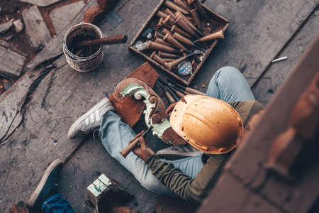 Carpenter - wood carving master performs artistic wood carving with special tools. Thailand, Pattaya 2019-12-25のeditorial素材