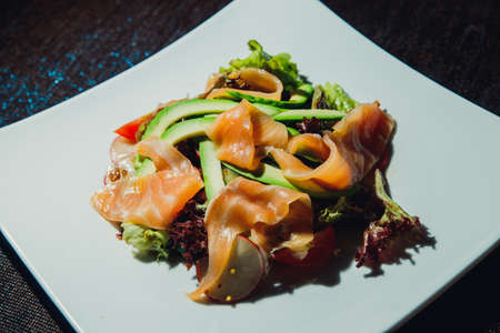 Salmon Salad with Avacado, Radish, Lola Rossa Lettuce, Tomato.の写真素材