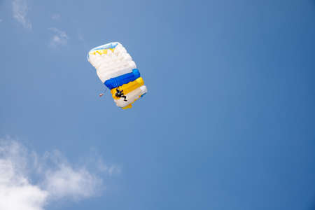 Skydiver soars in the blue sky. Acceptanceの写真素材