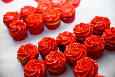 Close up of tray with lot delicious diversity pastry cakes tartlets. Fresh, multicoloured, colourful red and sweet berry desserts, beautifully decoratedの写真素材
