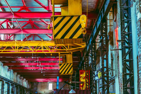 The interior of a big industrial building or factory with steel constructionsの写真素材