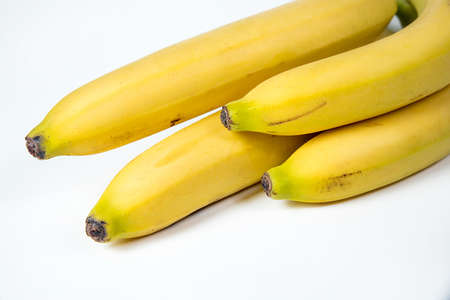 bananas against white background. four things. banana, isolated, white, yellow, healthy,の写真素材