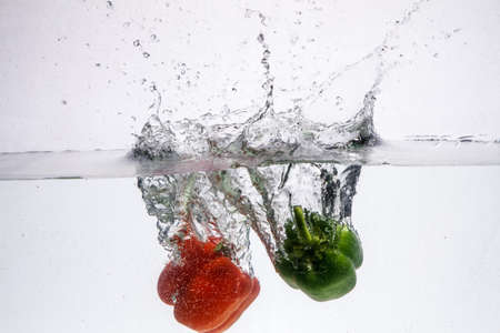 Fresh pineapple jumping into waterの写真素材