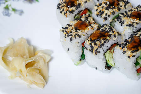 Sushi and rolls home delivery. Krpny plan. Sesame, salmon, cheese.の写真素材