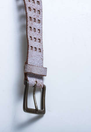 Leather belt on a white background. Element. Buckle.