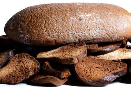 Black bread close-up. Texture on white backgroundの写真素材