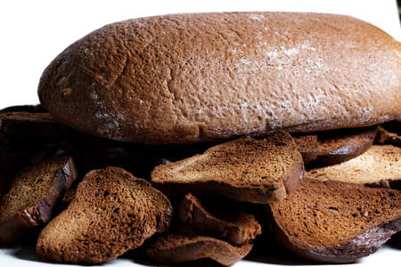 Black bread close-up. Texture on white backgroundの写真素材