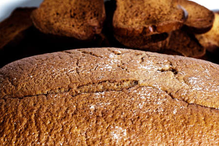 Black bread close-up. Texture on white backgroundの写真素材