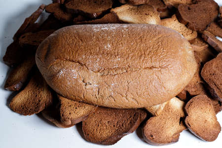 Black bread close-up. Texture on white backgroundの写真素材