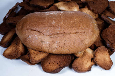 Black bread close-up. Texture on white backgroundの写真素材