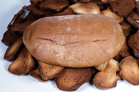 Black bread close-up. Texture on white backgroundの写真素材