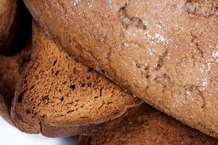 Black bread close-up. Texture on white backgroundの写真素材