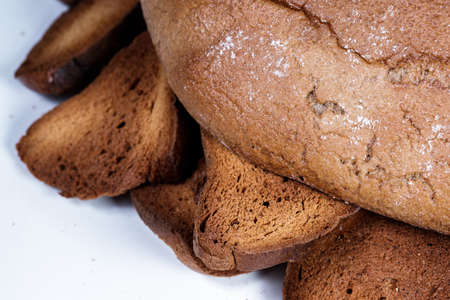 Black bread close-up. Texture on white backgroundの写真素材
