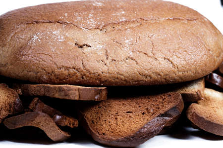 Black bread close-up. Texture on white backgroundの写真素材
